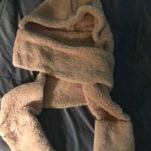 Hat with attached scarf and hand fit into scarf.